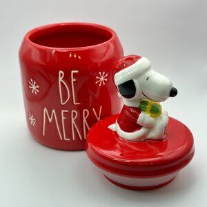 Snoopy figurine holding a present treat jar by Rae Dunn | Be Merry canister